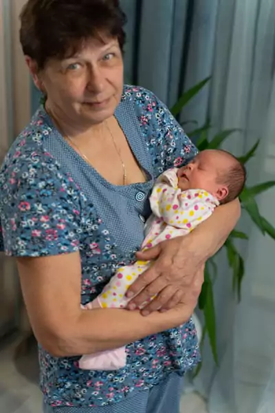 Casey with her newborn Granddaughter