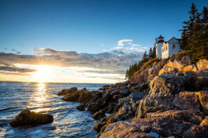 Scenic view of Bar Harbor, Maine coastline with blue ocean and lush green hills