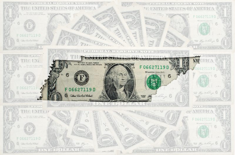 An outline of the state of Tennessee over dollar bills by Century Support Services