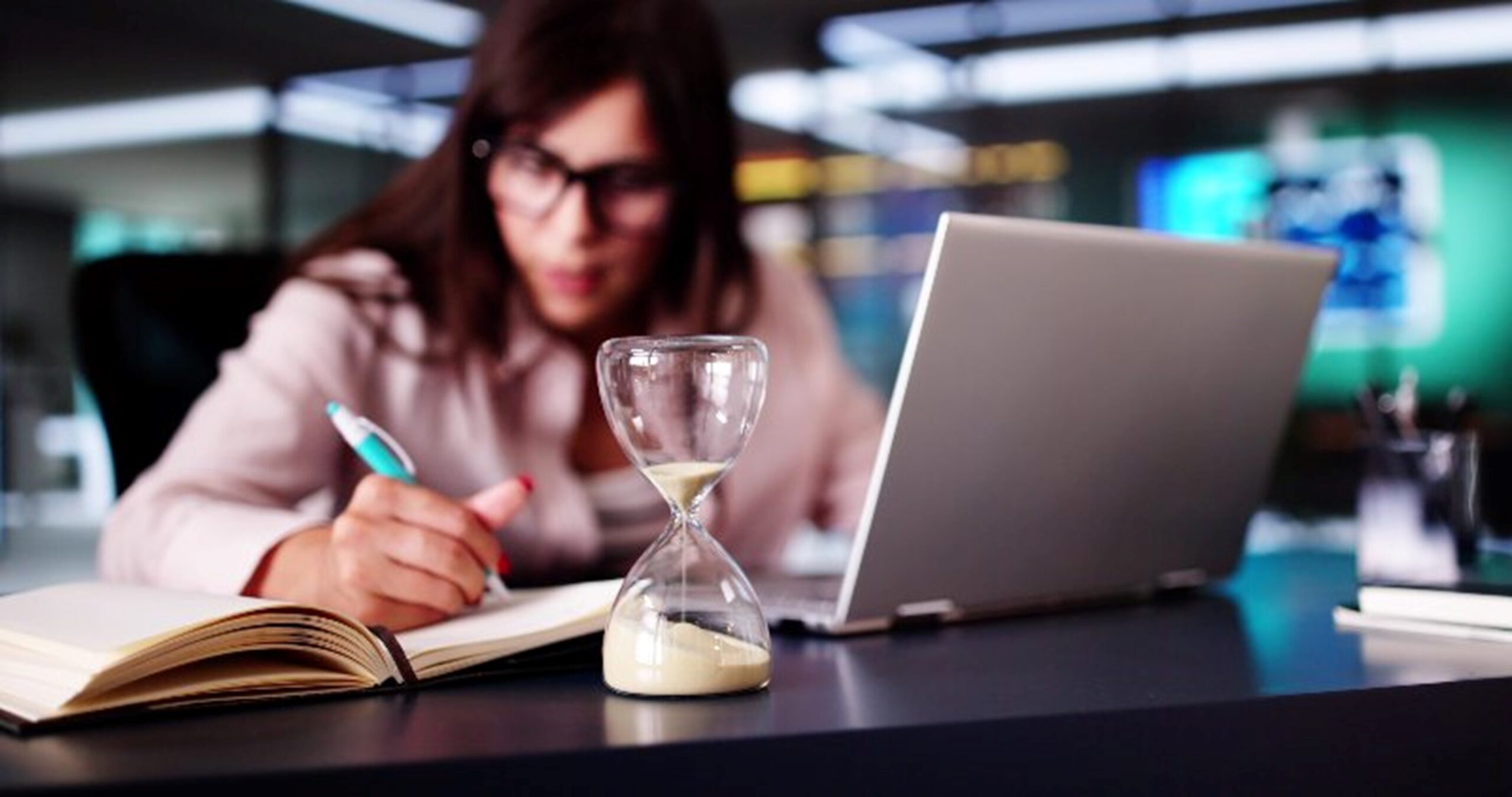 A woman working on a debt timeline by Century Support Services